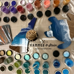 A table with paint and other supplies on it.