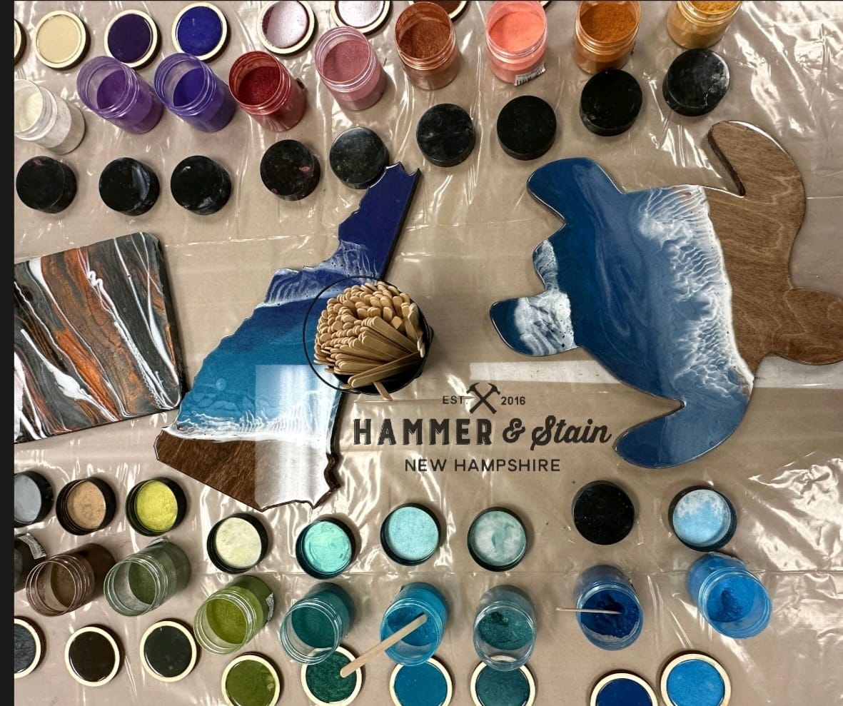 A table with paint and other supplies on it.